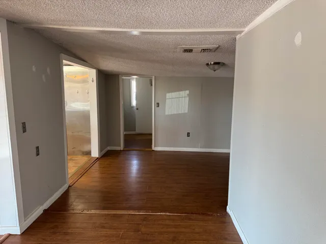 a view of a entrance door with wooden floor