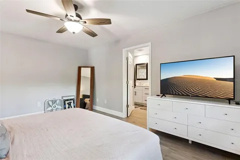 a bedroom with a bed and a dresser