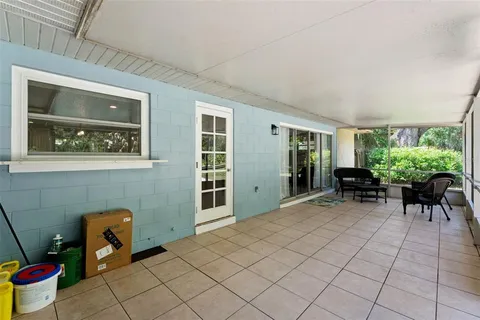 a view of a livingroom with furniture and a potted plant