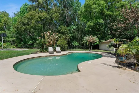 a view of a swimming pool with a park