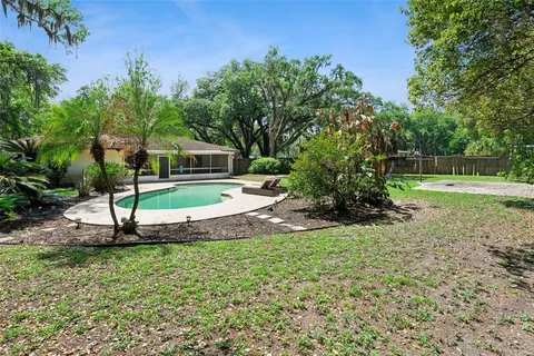 a view of a park with a house