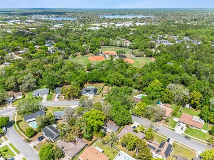 an aerial view of residential houses with outdoor space and street view