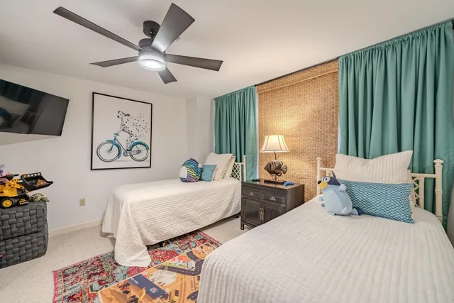 a bathroom with a double vanity sink toilet and shower