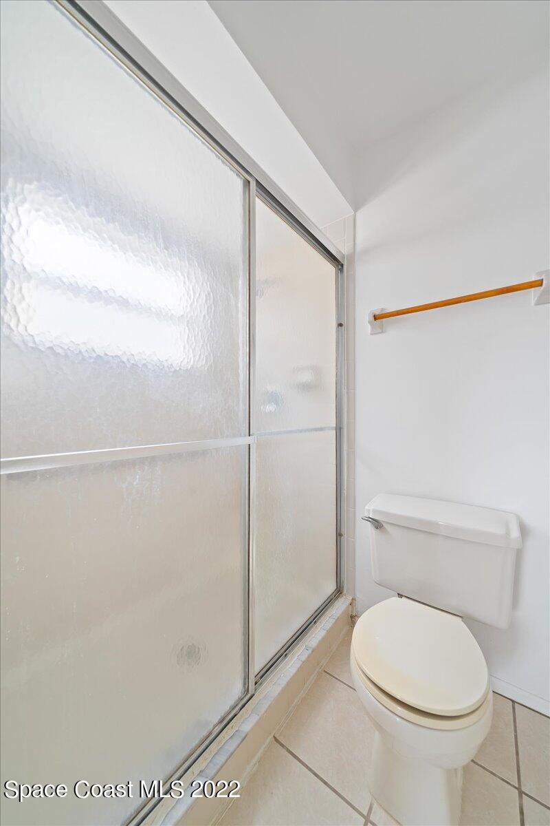 3709 Tree Line Boulevard Melbourne, FL 32935 - Photo 15 of 22 a bathroom with a toilet and a shower