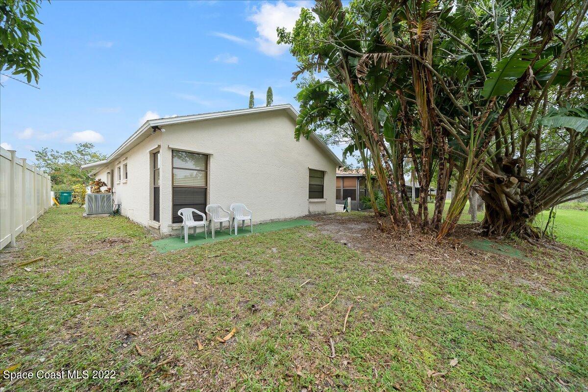 3709 Tree Line Boulevard Melbourne, FL 32935 - Photo 20 of 22 a view of a house with a yard