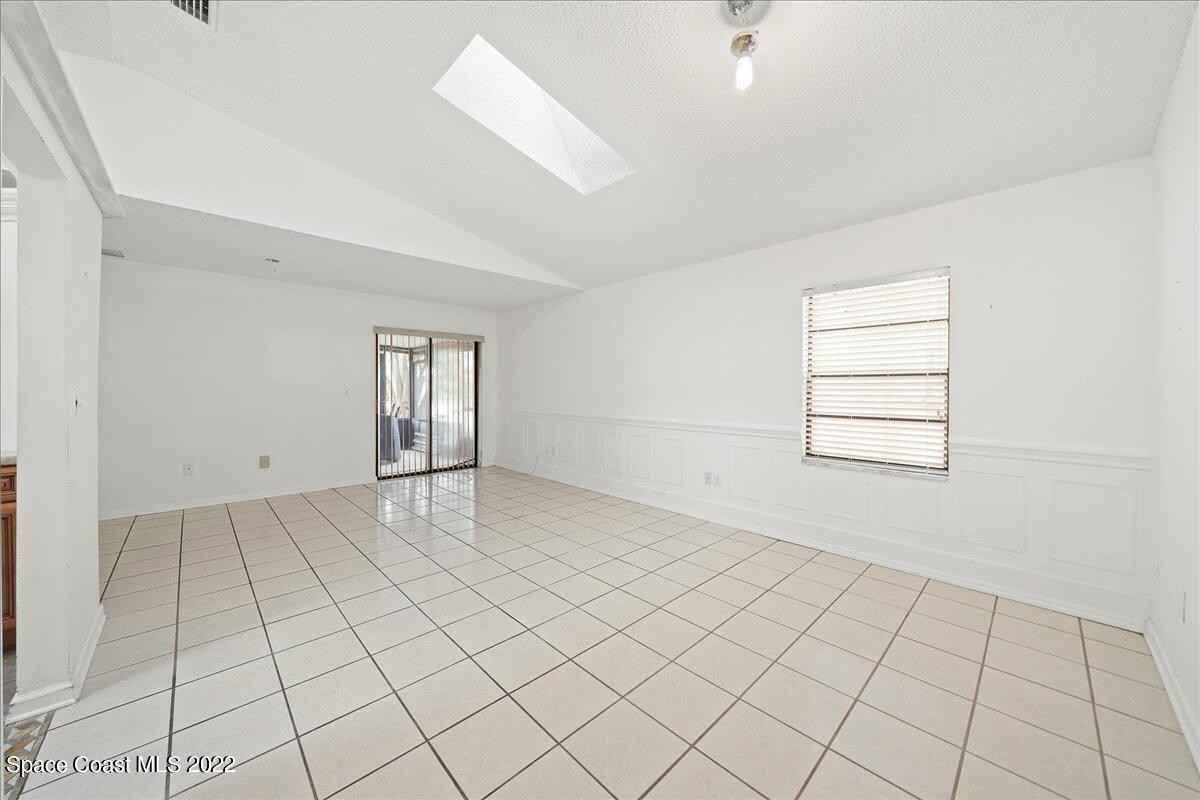 3709 Tree Line Boulevard Melbourne, FL 32935 - Photo 8 of 22 an empty room with windows