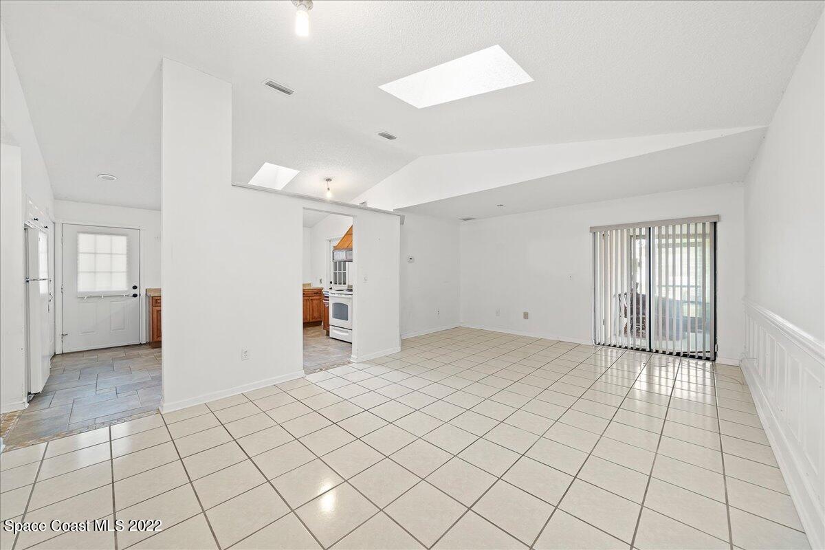 3709 Tree Line Boulevard Melbourne, FL 32935 - Photo 9 of 22 a view of an empty room and window