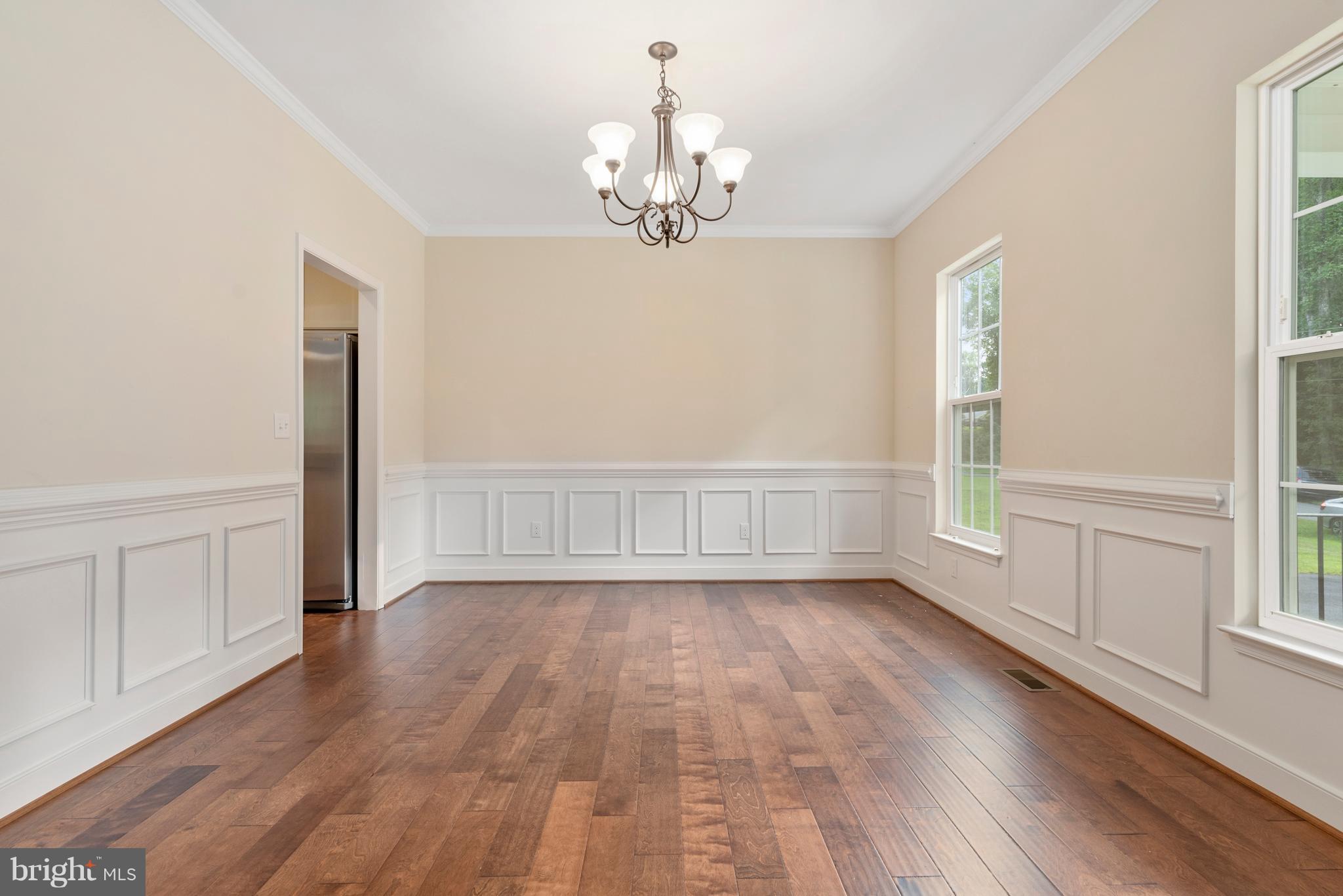 138 Sandy Ridge Road Fredericksburg, VA 22405 - Photo 11 of 30 a view of an empty room with wooden floor and a window