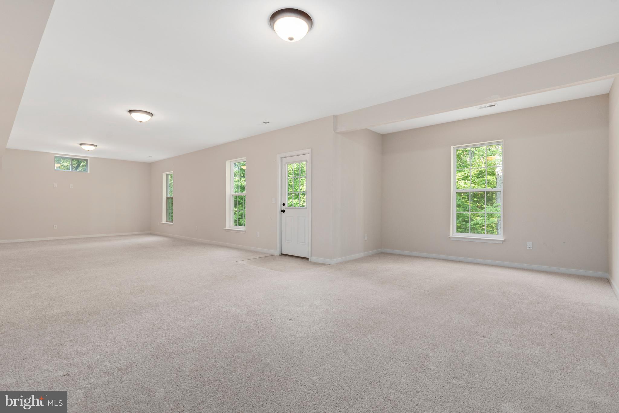 138 Sandy Ridge Road Fredericksburg, VA 22405 - Photo 27 of 30 an empty room with windows and closet