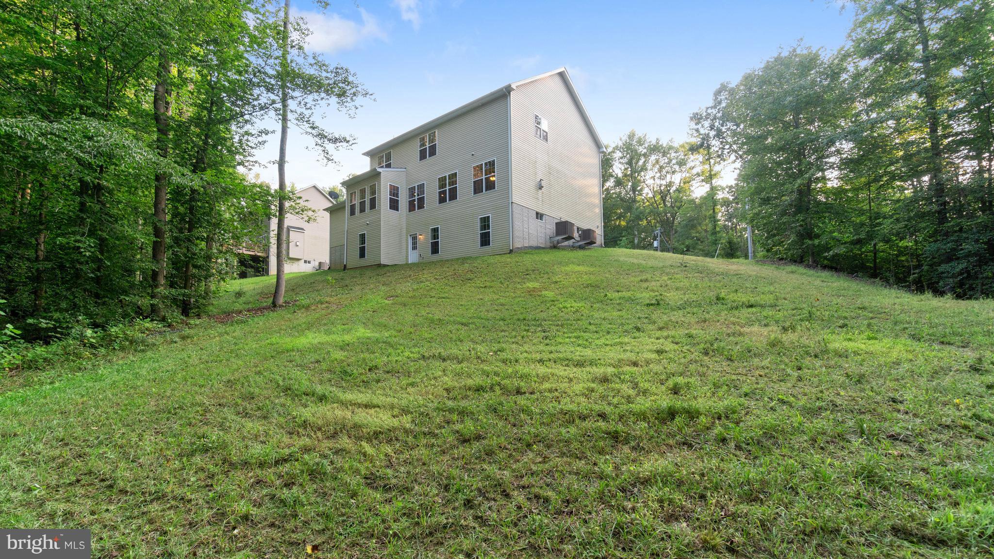 138 Sandy Ridge Road Fredericksburg, VA 22405 - Photo 29 of 30 a view of a house with backyard