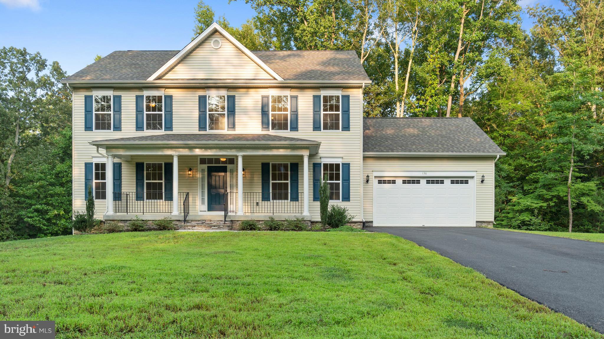 138 Sandy Ridge Road Fredericksburg, VA 22405 - Photo 30 of 30 front view of a house with a yard
