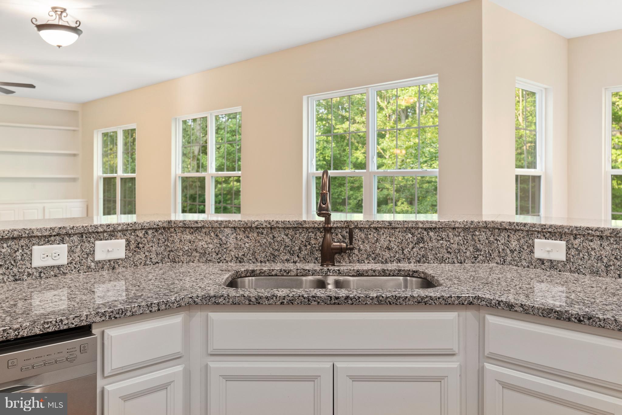 138 Sandy Ridge Road Fredericksburg, VA 22405 - Photo 4 of 30 a kitchen with granite countertop a sink and a window