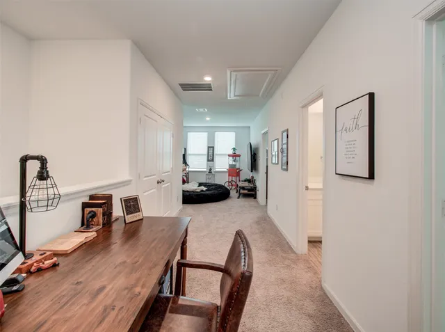 a view of a livingroom with furniture and kitchen