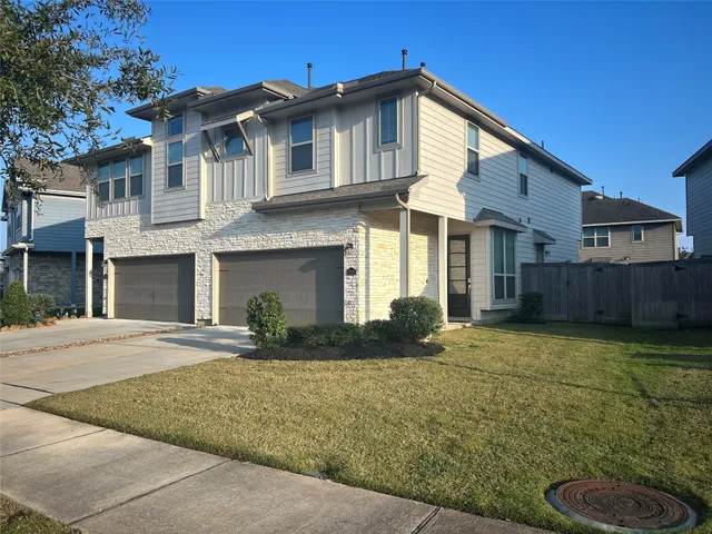a front view of a house with yard