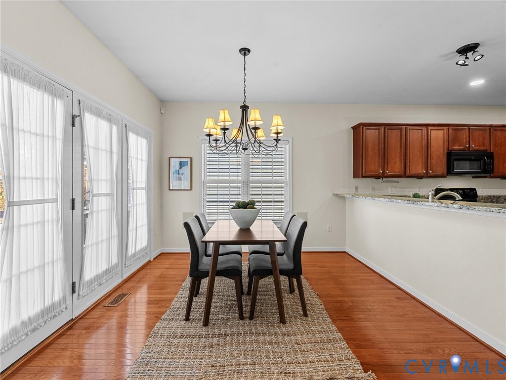 14300 Brading Court Midlothian, VA 23112 - Photo 12 of 50 Bright eat-in kitchen with hardwood floors, granit