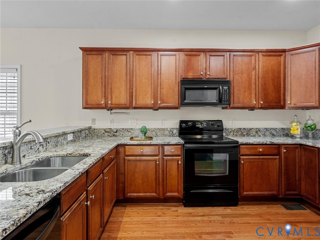 14300 Brading Court Midlothian, VA 23112 - Photo 14 of 50 Granite countertops and abundant cabinetry provide