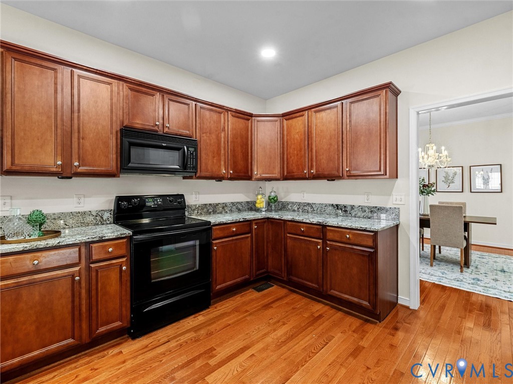 14300 Brading Court Midlothian, VA 23112 - Photo 15 of 50 “Granite countertops, rich wood cabinetry, and ope