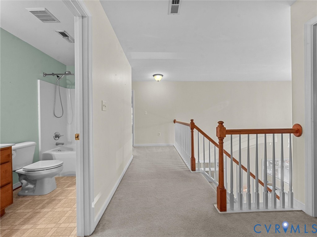 14300 Brading Court Midlothian, VA 23112 - Photo 30 of 50 pper-Level Hallway & Bath:
“Spacious upstairs hal