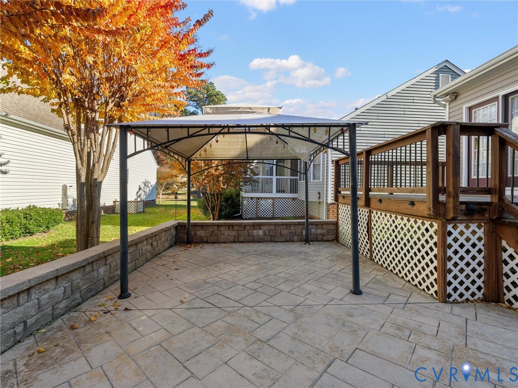 14300 Brading Court Midlothian, VA 23112 - Photo 3 of 50 Spacious stamped-concrete patio with pergola—perfe
