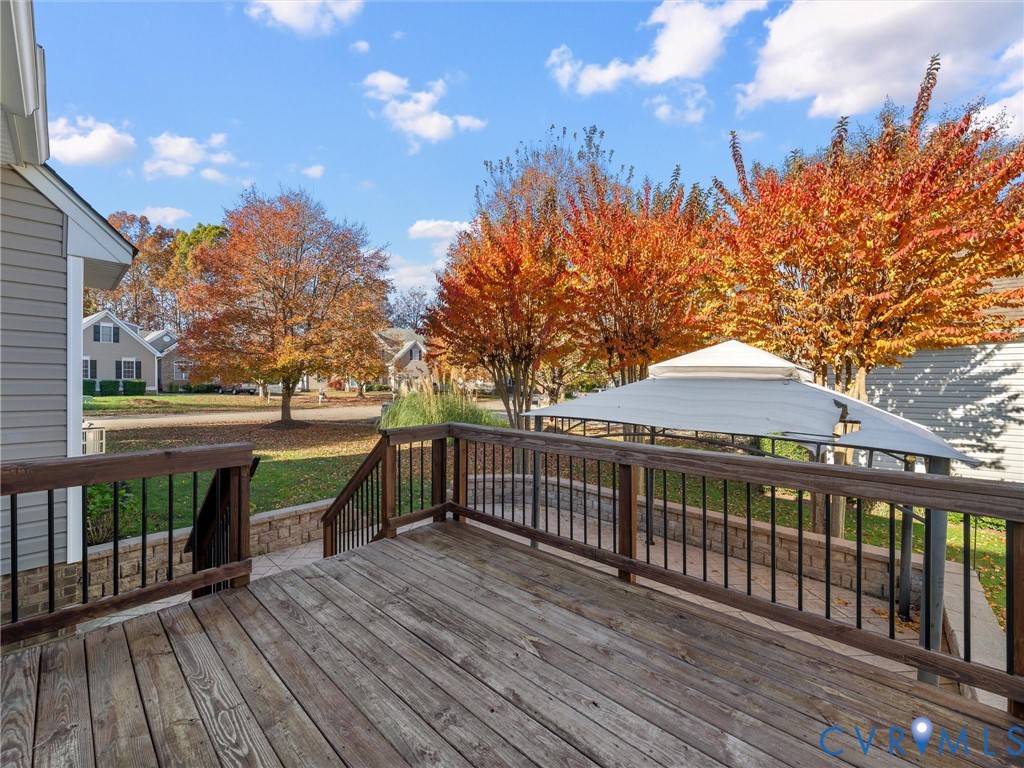 14300 Brading Court Midlothian, VA 23112 - Photo 46 of 50 Deck View:
“Spacious deck overlooking the landsca