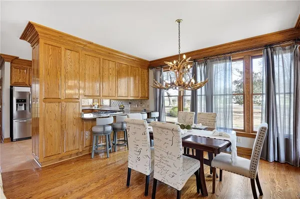 a bathroom with a granite countertop sink a mirror and a shower