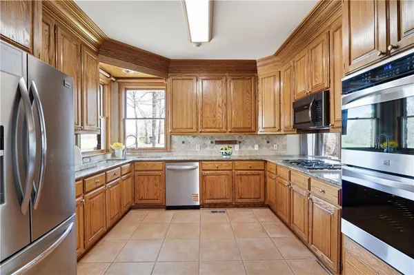 a view of a livingroom with a ceiling fan and window