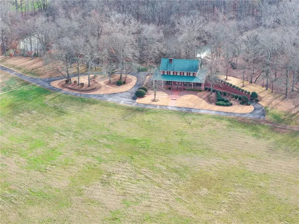 a view of a swimming pool with an outdoor seating