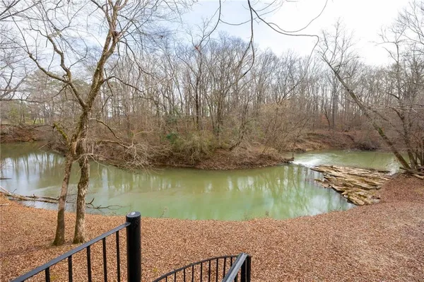 a view of a big yard with a fountain