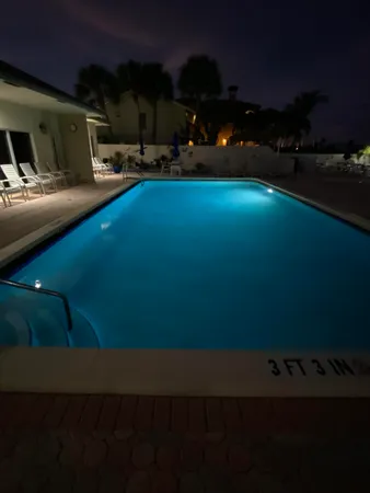 a view of back yard of the house and car parked
