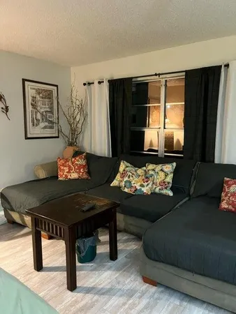 a living room with furniture and a table