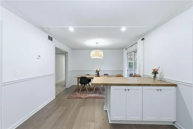 a kitchen with a sink cabinets and appliances