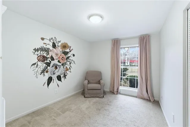 a view of workspace with furniture and window