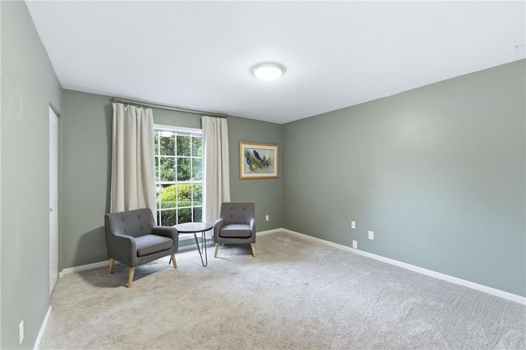 3825 Lavista Road, Unit A1 Tucker, GA 30084 - Photo 16 of 30 a living room with furniture and a window