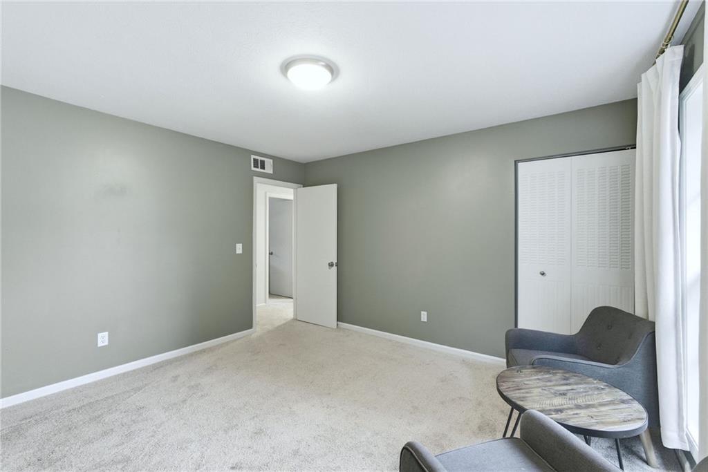 3825 Lavista Road, Unit A1 Tucker, GA 30084 - Photo 17 of 30 a living room with furniture and a window