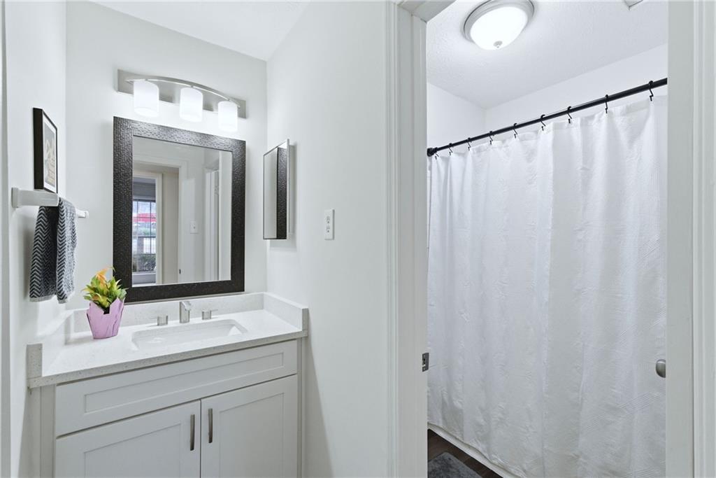 3825 Lavista Road, Unit A1 Tucker, GA 30084 - Photo 19 of 30 a bathroom with a sink and a mirror
