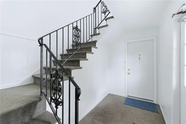 a view of entryway with wooden floor