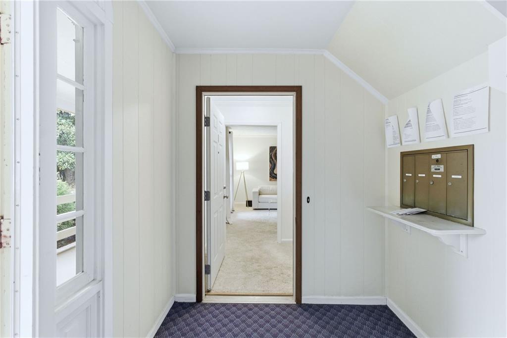 3825 Lavista Road, Unit A1 Tucker, GA 30084 - Photo 24 of 30 a view of a hallway with wooden floor and cabinet