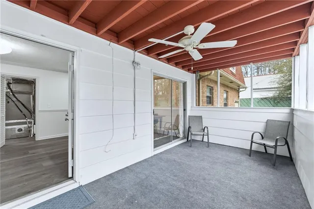 a view of a livingroom with furniture and windows