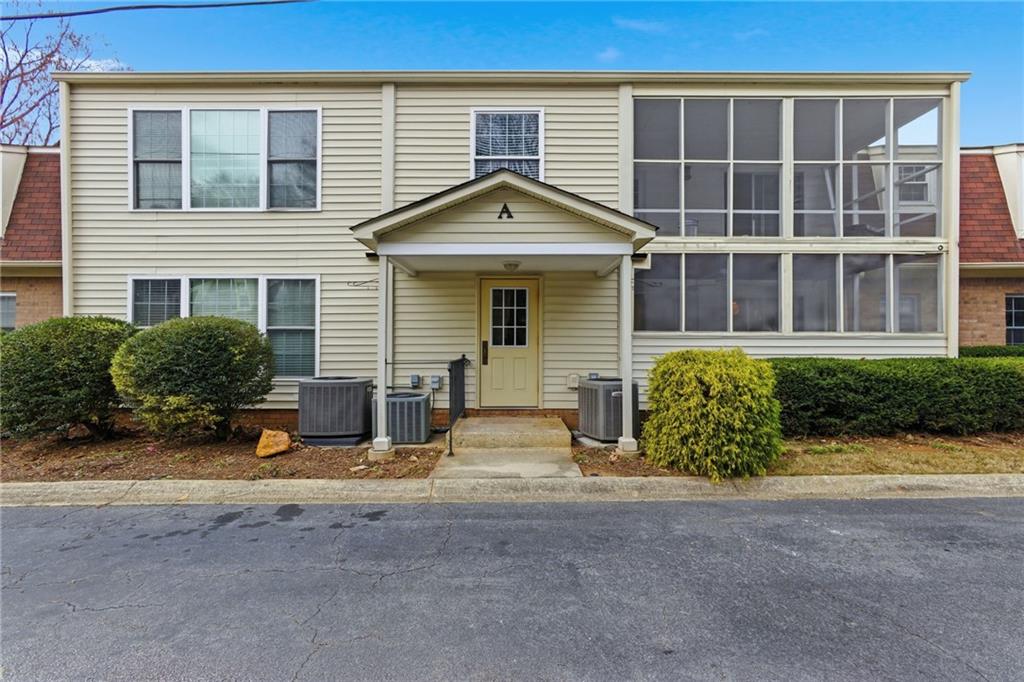 3825 Lavista Road, Unit A1 Tucker, GA 30084 - Photo 27 of 30 front view of a house with a outdoor space