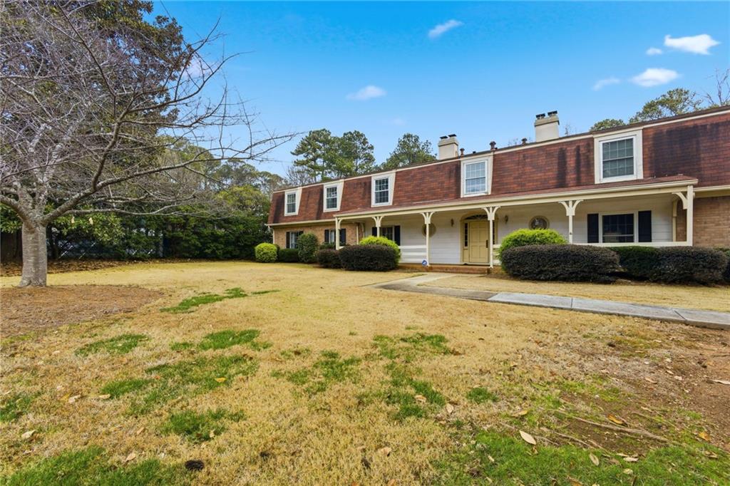 3825 Lavista Road, Unit A1 Tucker, GA 30084 - Photo 28 of 30 a front view of a house with a yard