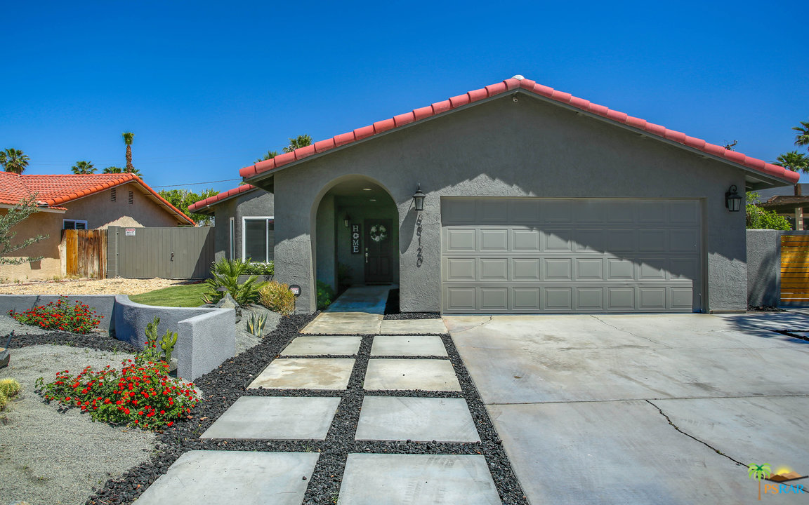 68120 Risueno Road Cathedral City, CA 92234 - Photo 3 of 35 a front view of a house with a yard