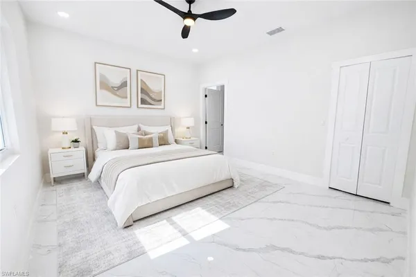 an empty room with kitchen entrance and hallway