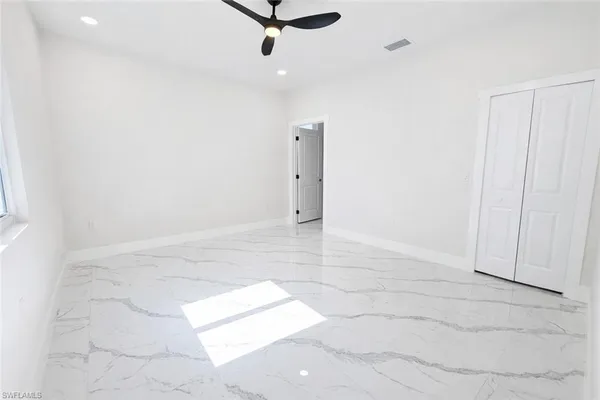 a bathroom with a toilet a sink and shower curtain