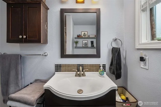 a bathroom with a sink and a mirror