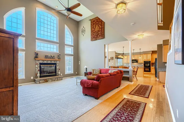 a view of an empty room with a ceiling fan