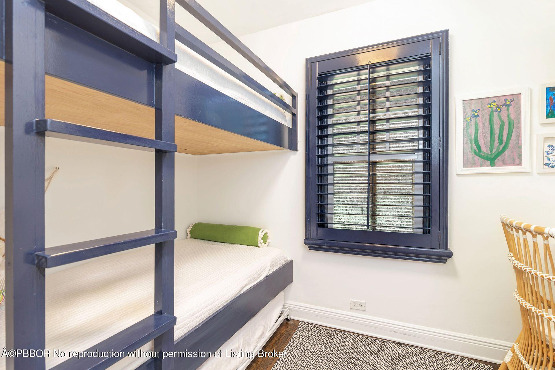 231 Cocoanut Row Palm Beach, FL 33480 - Photo 18 of 27 a bedroom with a bed and a window