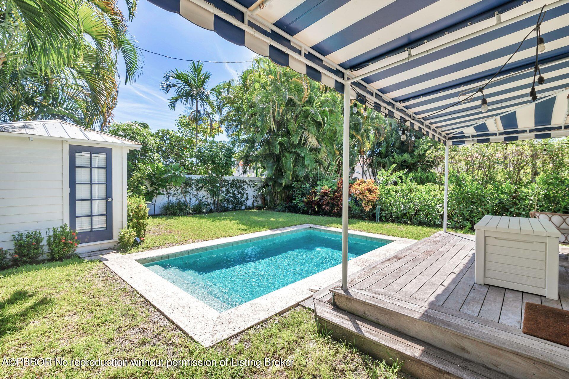 231 Cocoanut Row Palm Beach, FL 33480 - Photo 23 of 27 a view of a backyard with swimming pool