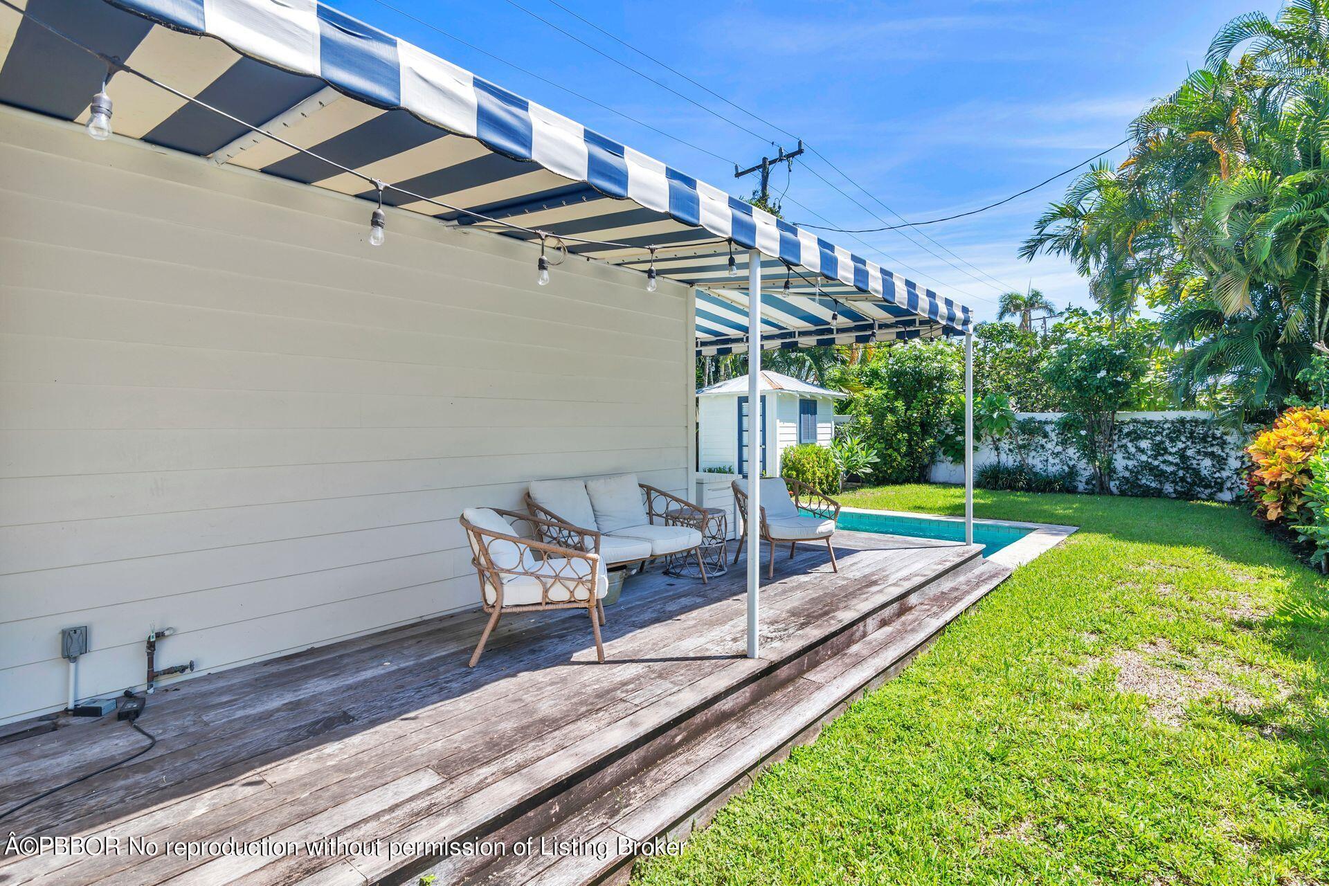 231 Cocoanut Row Palm Beach, FL 33480 - Photo 24 of 27 a building outdoor space with patio furniture and garden