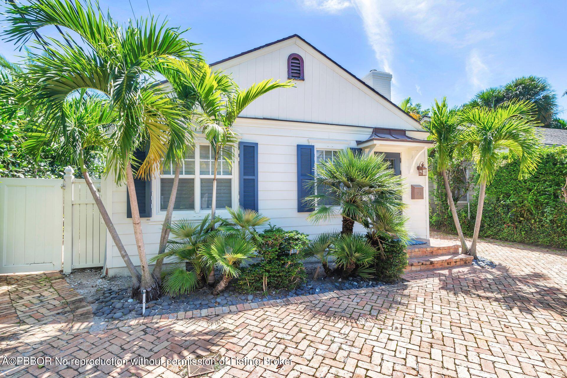 231 Cocoanut Row Palm Beach, FL 33480 - Photo 3 of 27 a front view of a house with garden