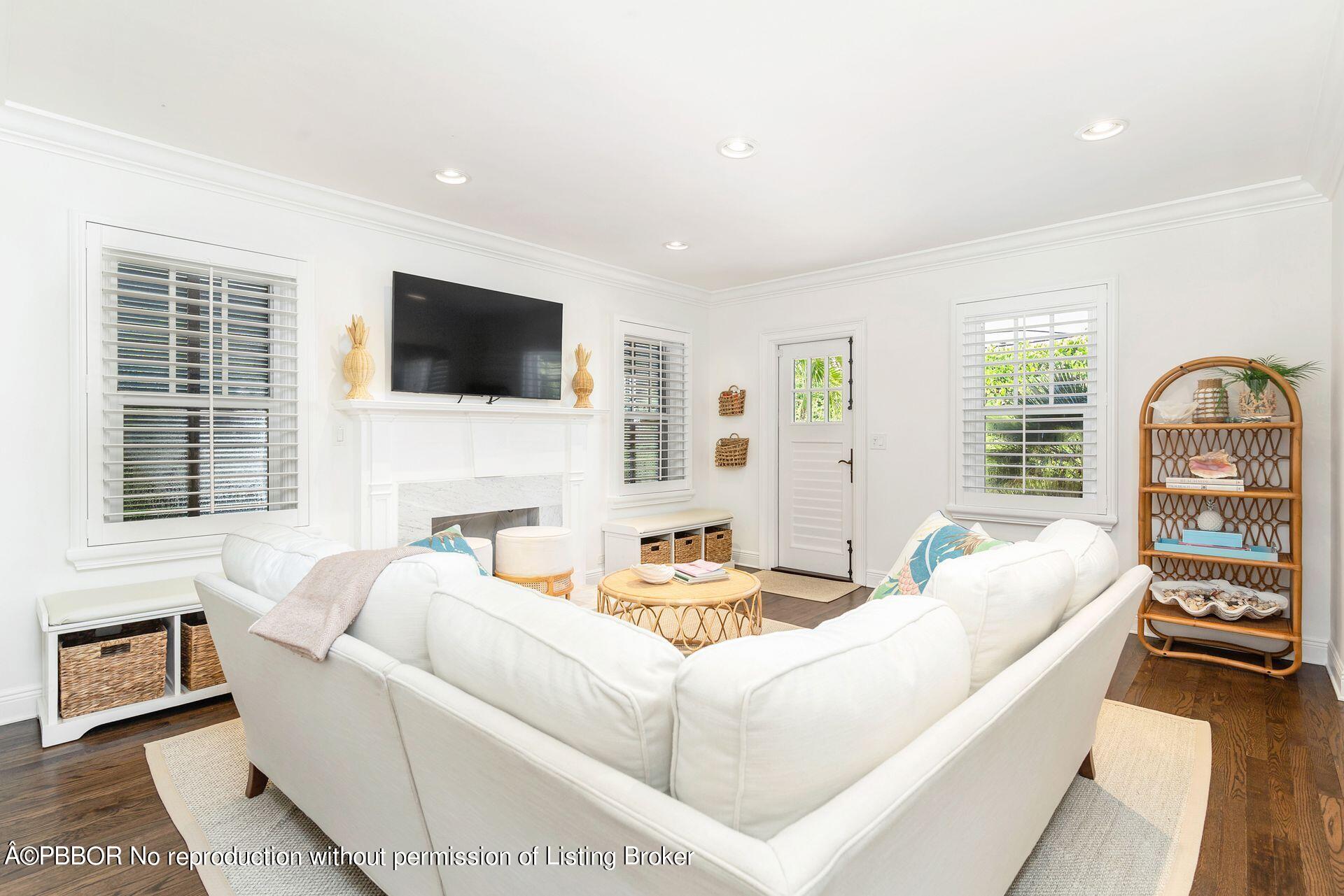 231 Cocoanut Row Palm Beach, FL 33480 - Photo 7 of 27 a living room with fireplace furniture and a flat screen tv
